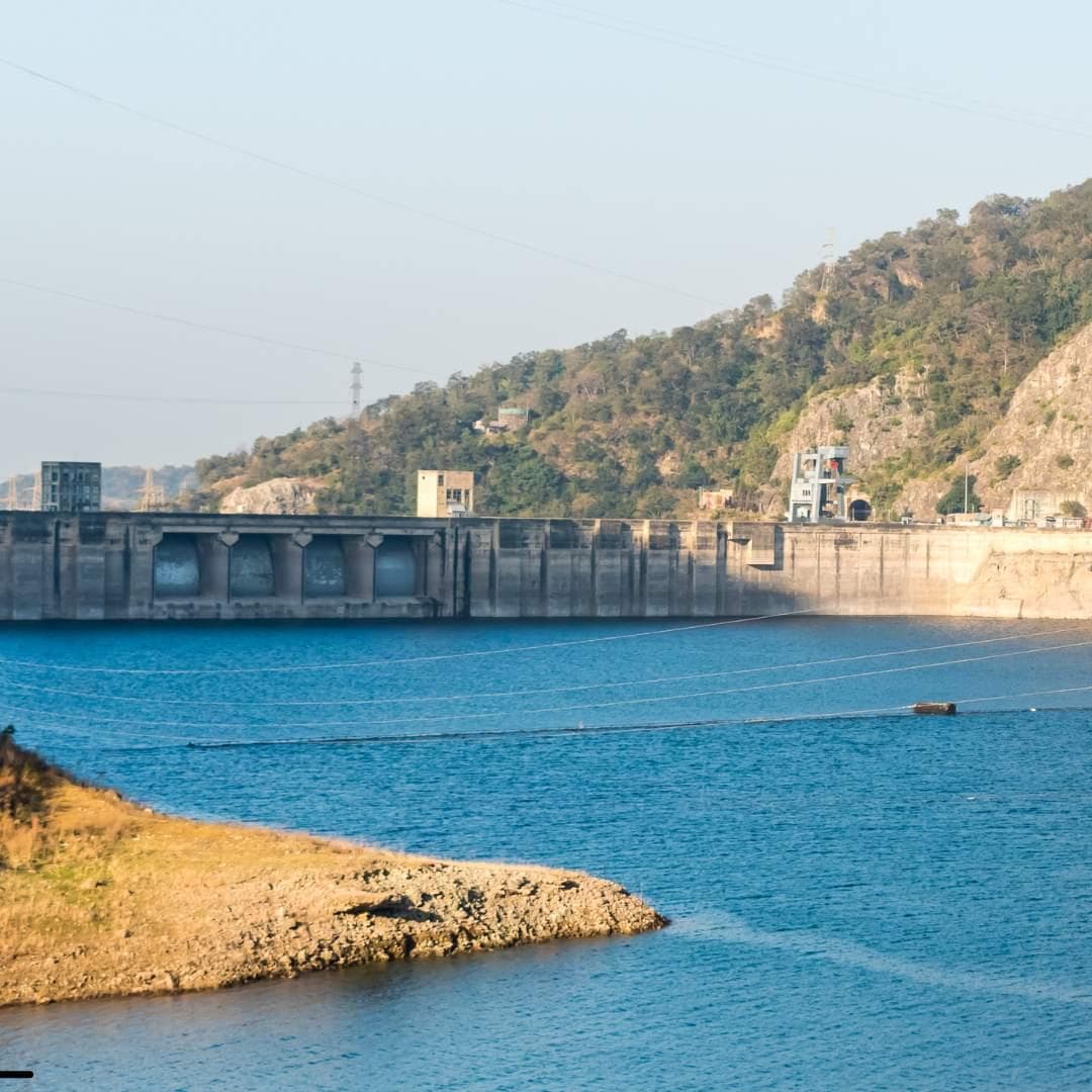 Bhakra Nangal Dam, a massive concrete structure on the Sutlej River in India, with the water reservoir